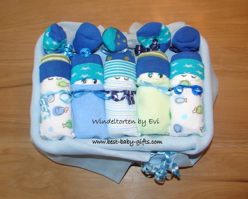 5 diaper babies in a basket in blue colors