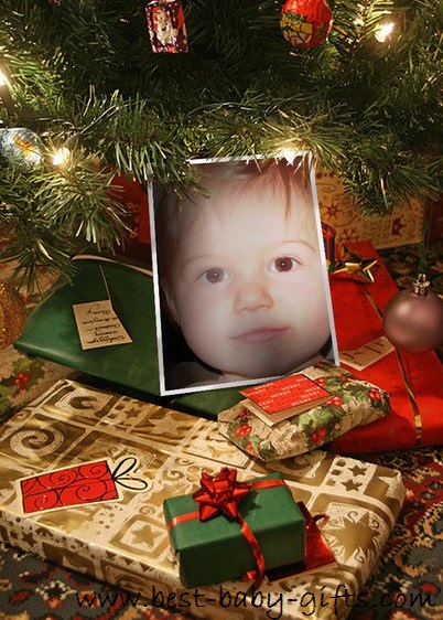a Christmas tree with lights and lots of presents in front and a big toddler girl face placed into the photo