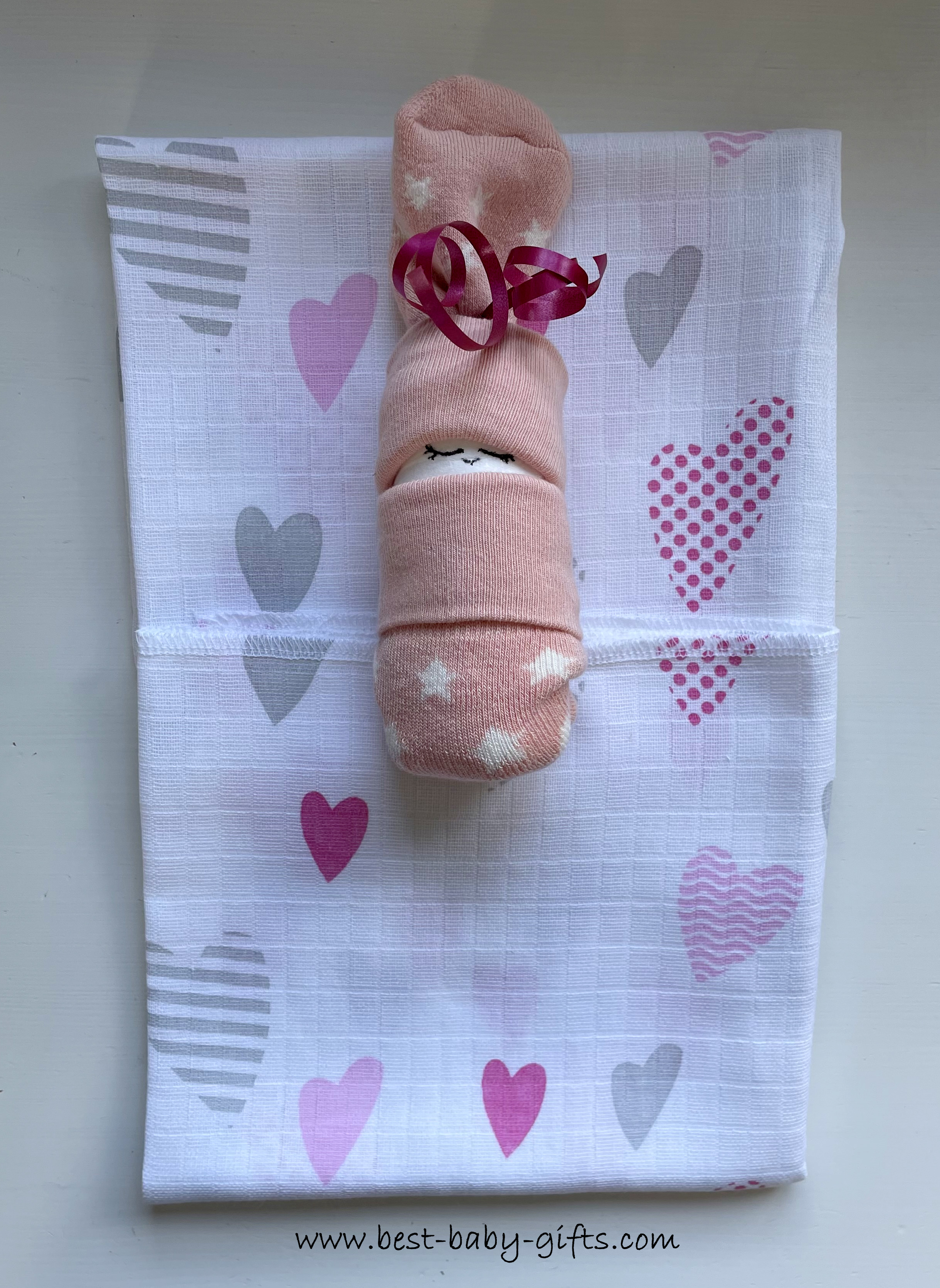 step 4, the sock baby placed on the folded cloth