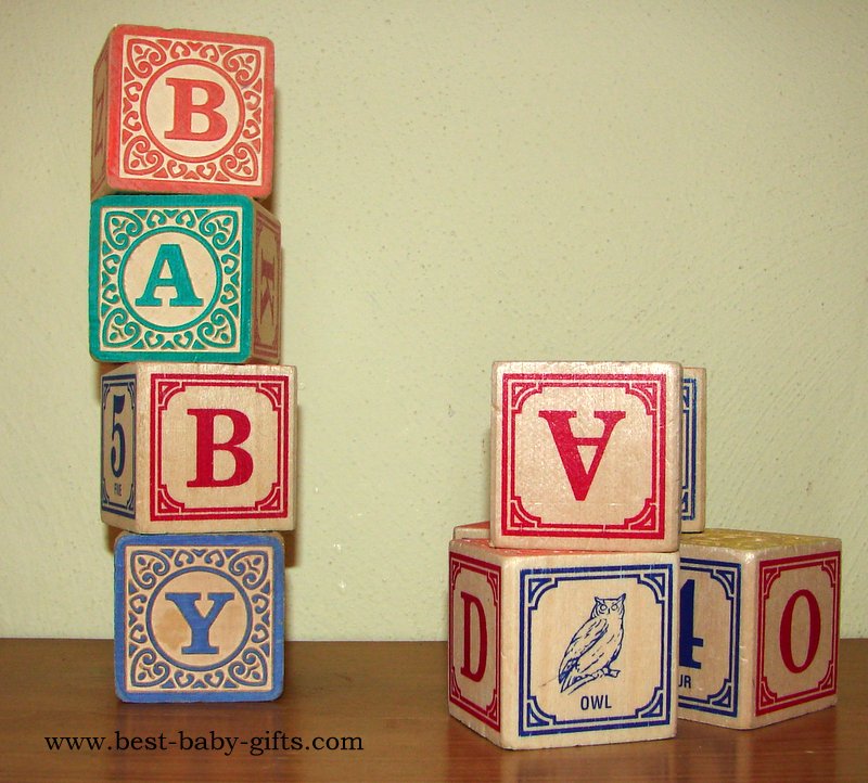wooden baby blocks, printed in old-fashioned style, showing letters and animals, some spelling "baby"
