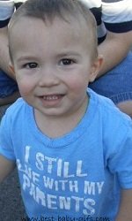 a baby boy wearing a blue shirt saying "I still live with my parents"