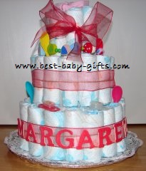 a large diaper cake with 3 tiers, with a big bow and red ribbons, personalized Margarethe