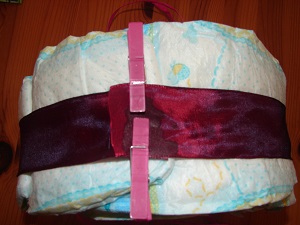 dark red ribbon fixed around the diapers dark red ribbon fixed around the diapers
