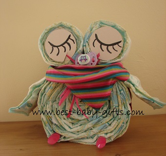 sleeping diaper owl in girl colors with colorful baby scarf
