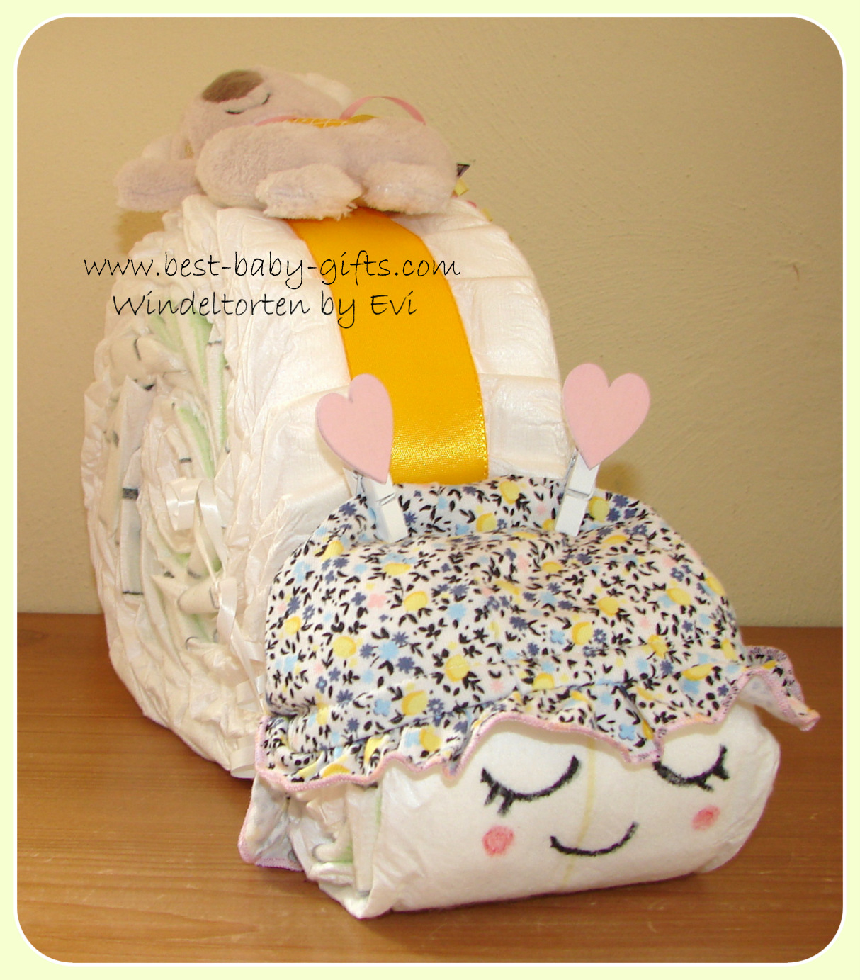 girl diaper snail with eyes, mouth and red cheeks drawn with felt pens