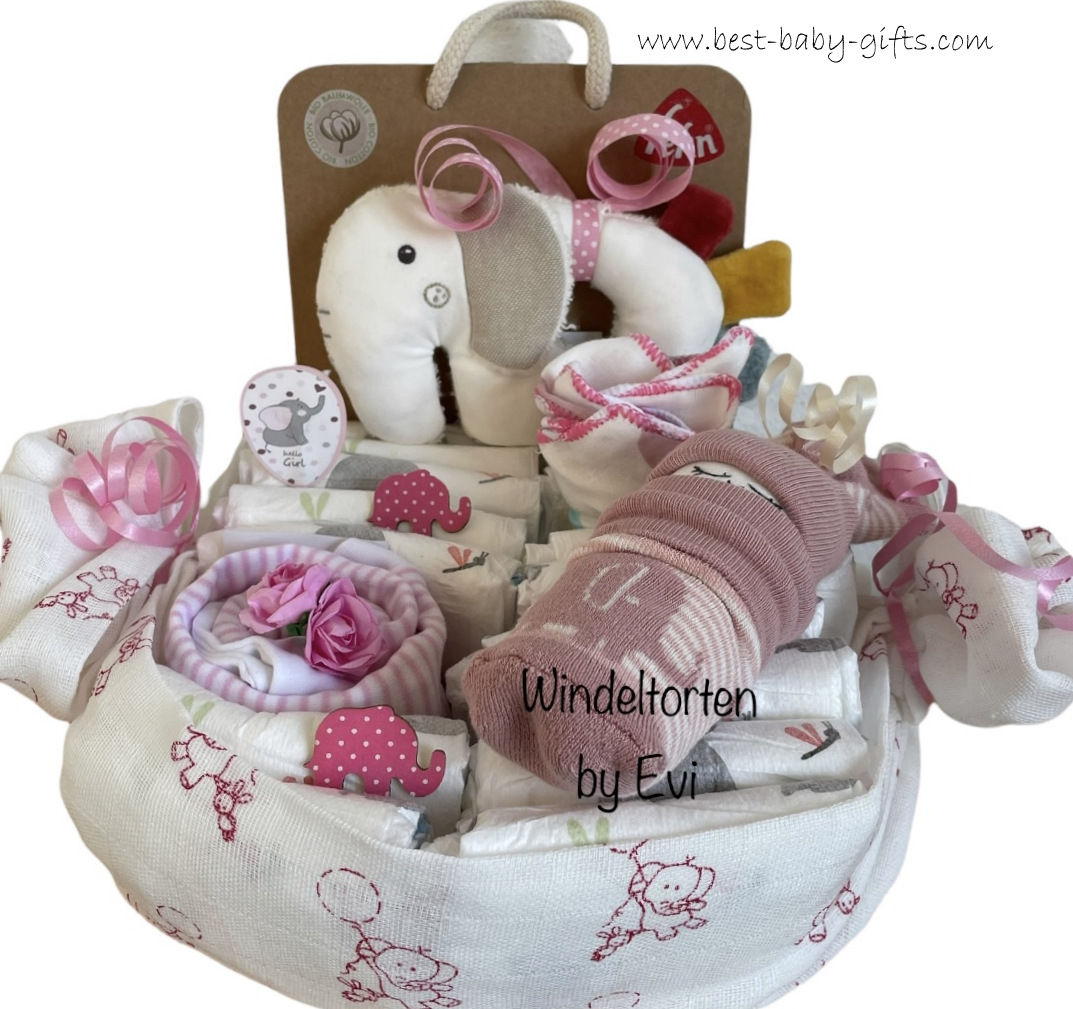 a large burp cloth filled with diapers and all sorts of baby stuff for baby girl - elephants everywhere!