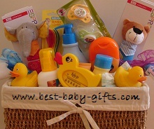colorful gift basket for twin babies, items included twice such as baby rattles and yellow rubber bathing ducks