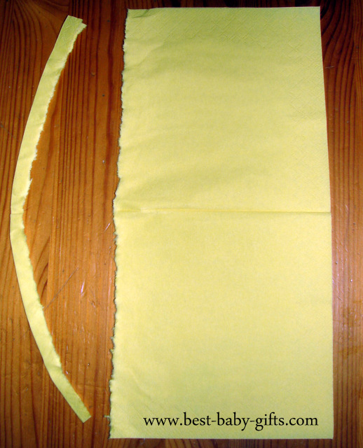 the piece at the left side has been ripped off and the napkin has been opened so it looks like a rectangle the piece at the left side has been ripped off and the napkin has been opened so it looks like a rectangle