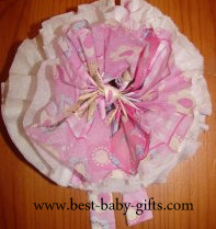 a finished napkin flower where only the top layer is colorful, the rest of the layers is just plain white