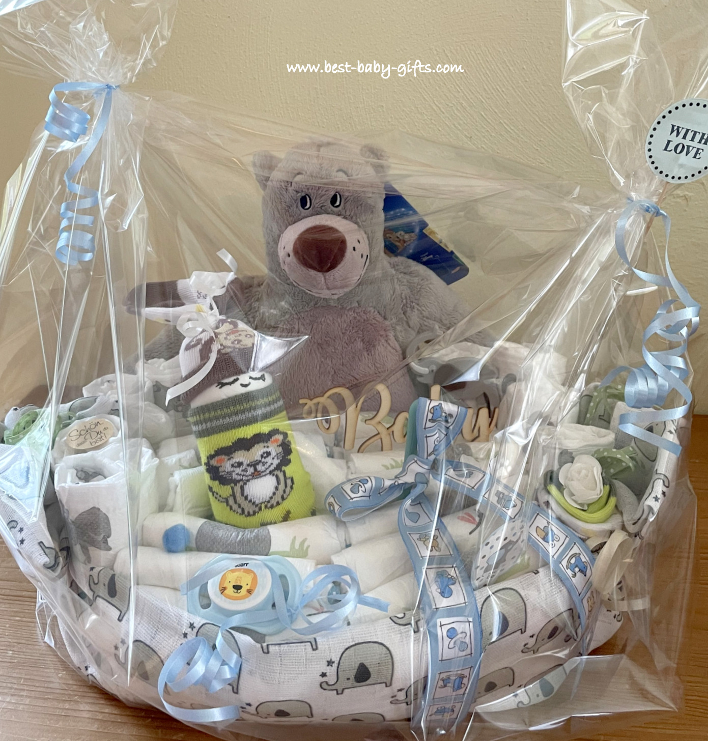 the finished jungle diaper cake wrapped in clear gift foil