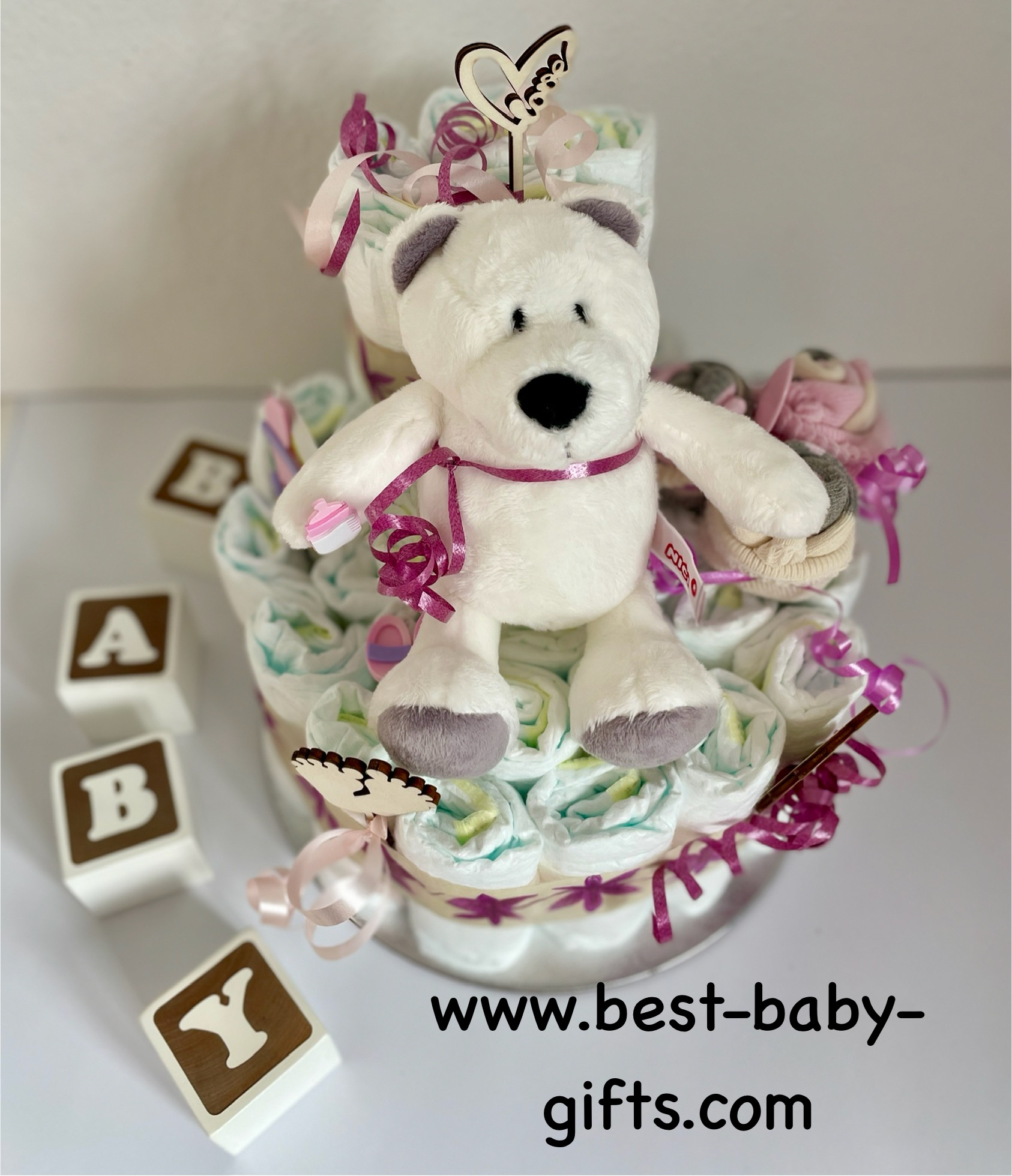 polar bear diaper cake in pink and white featuring a cute cuddly polar bear
