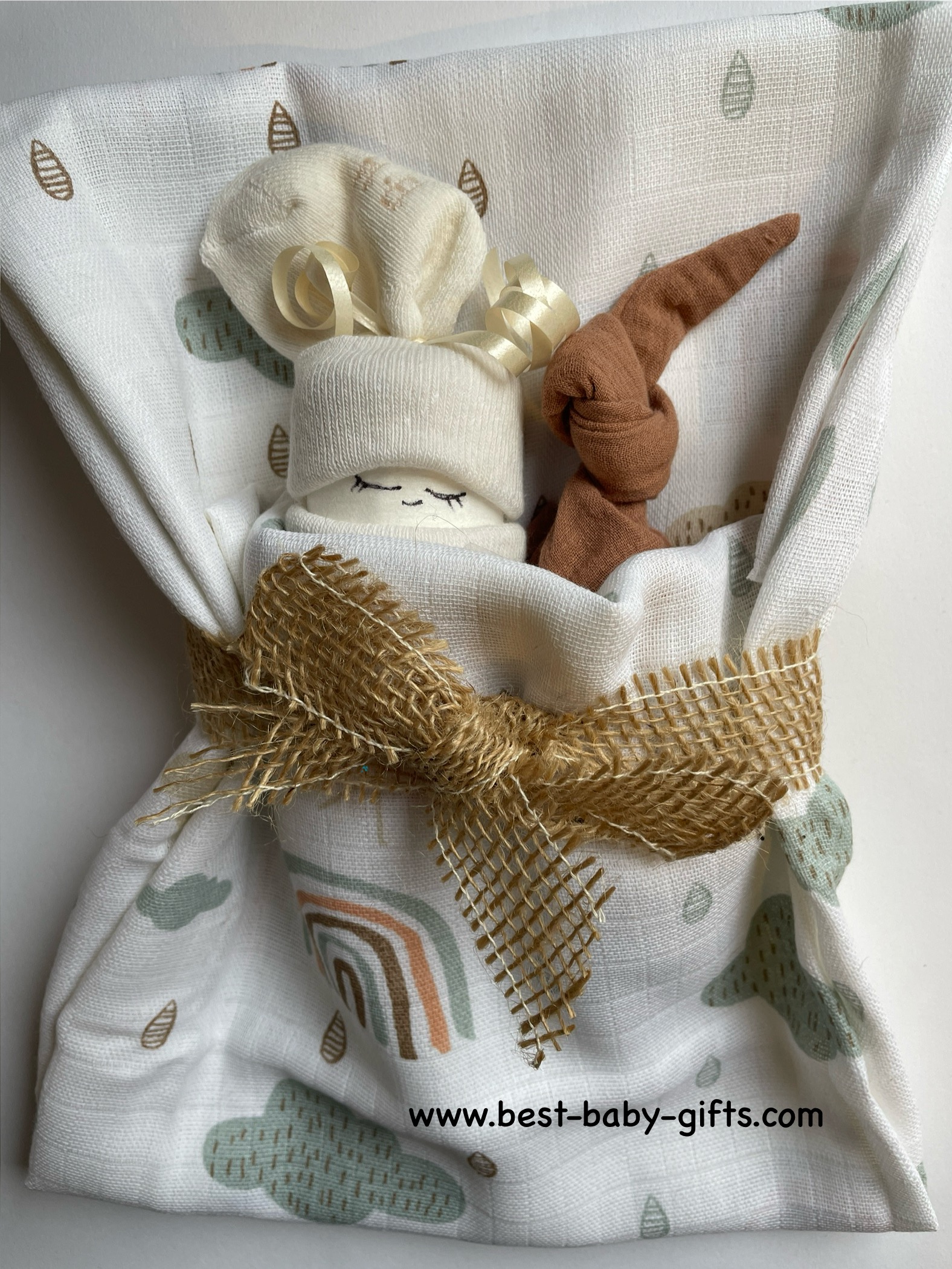 boho diaper gift: small diaper cake with a snuggly baby cloth