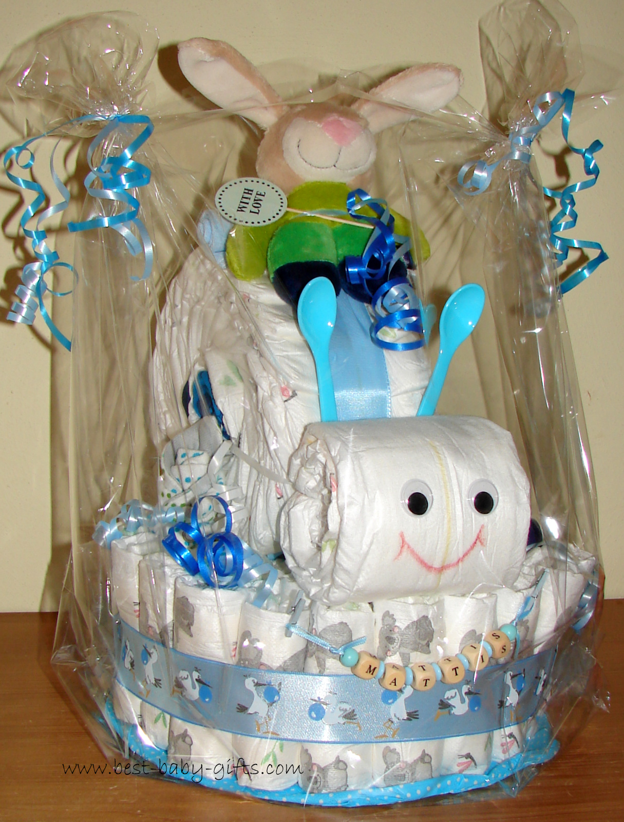 a diaper base with a diaper snail on top, blue and green colors