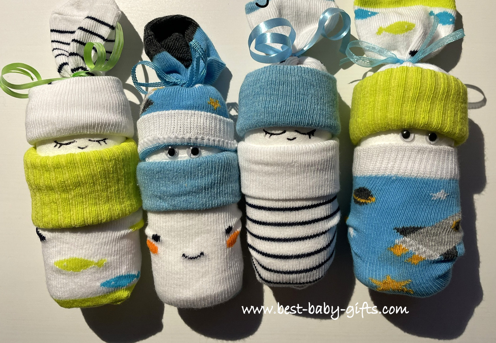 4 sock diaper babies for boys in blue, turquoise, gray and white, very vivid colors