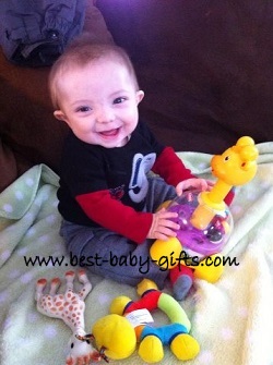baby boy with lots of toys including Sophie