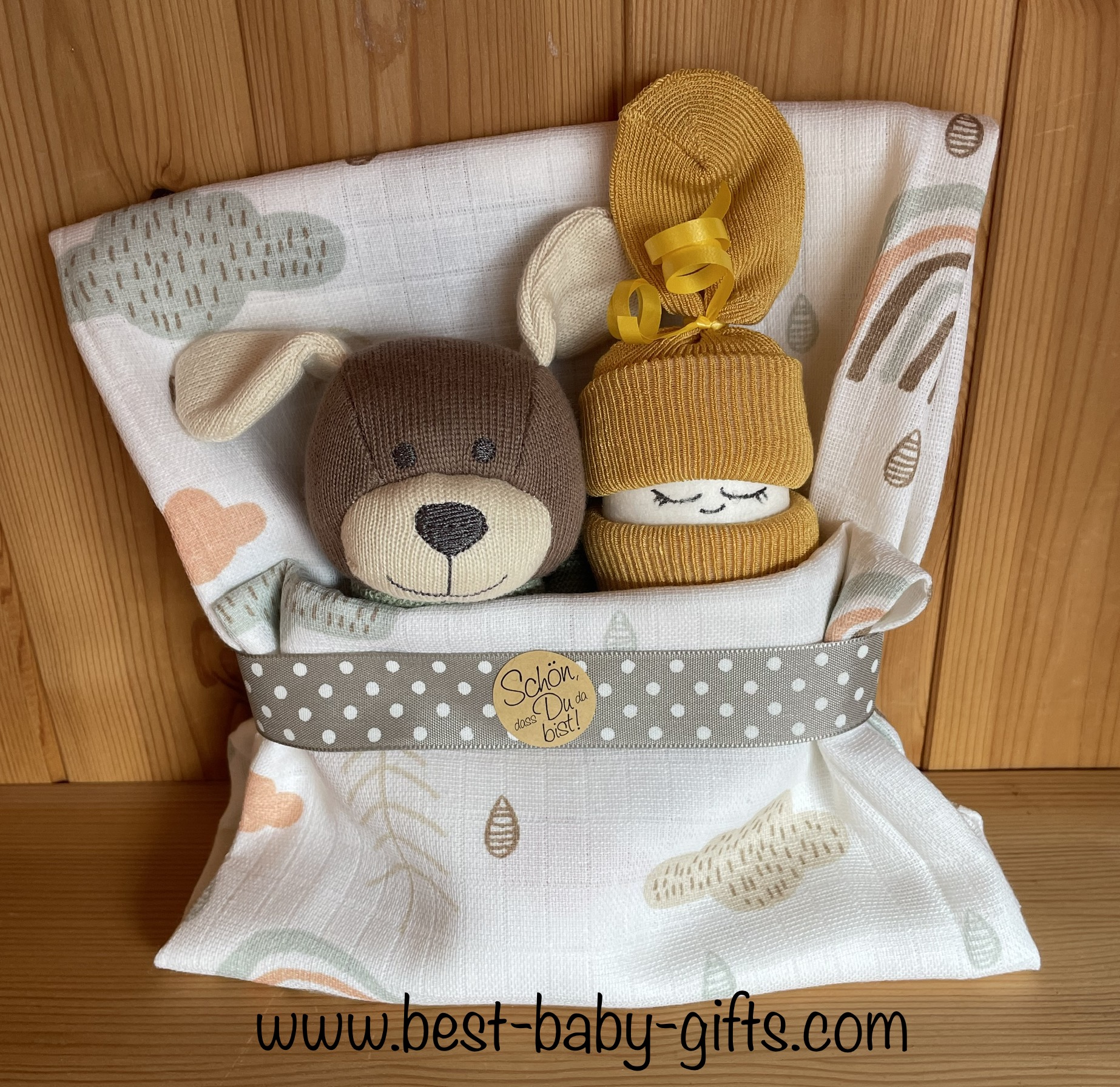 a diaper baby and a cuddly dog wrapped in a burp cloth, neutral colors