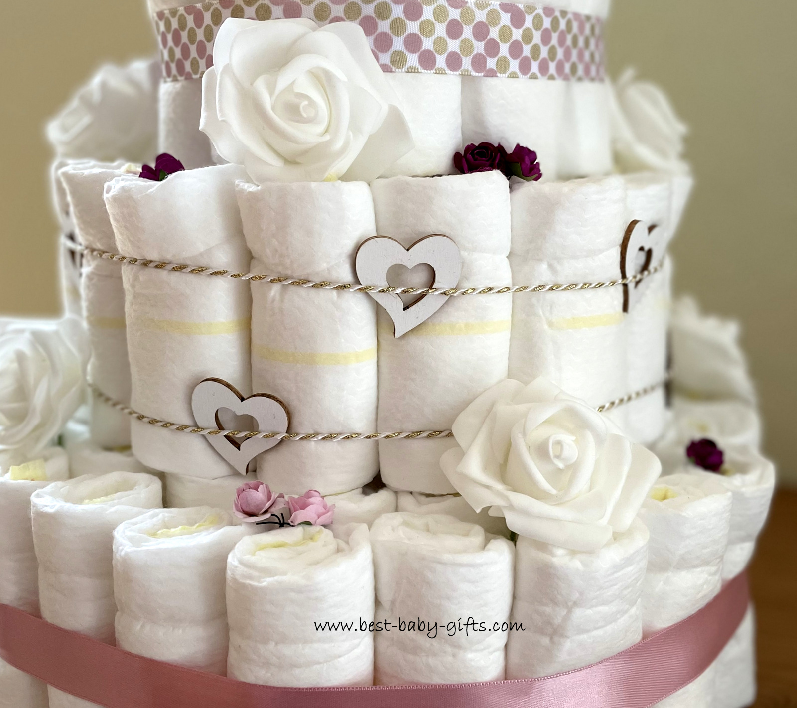 close-up of the diaper cake, showing the diapers, wooden hearts and artificial roses