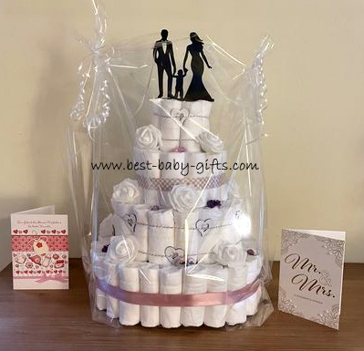 2 congratulations cards for the arrival of the baby and for Mr & Mrs and the cellophane wrapped diaper cake